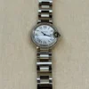 Montre Cartier Ballon Bleu QTZ 28 mm pour femme avec lunette sertie de diamants - Coffret complet
