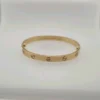 Bracelet Cartier Love en or jaune 18 carats, taille 18, fermoir à vis, neuf, avec boîte et papier