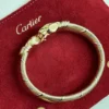 Bracelet Cartier Panthère Cougar Trinity en or jaune, blanc et rose 18 carats, service 2025