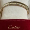 Bracelet Cartier Panthère Cougar Trinity en or jaune, blanc et rose 18 carats, service 2025