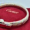 Bracelet Cartier Panthère Cougar Trinity en or jaune, blanc et rose 18 carats, service 2025