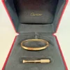 Bracelet Cartier Love en or rose, modèle moyen, avec boîte et documents d'origine.
