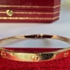Bracelet Cartier Love en or rose, modèle moyen, avec boîte et documents d'origine.