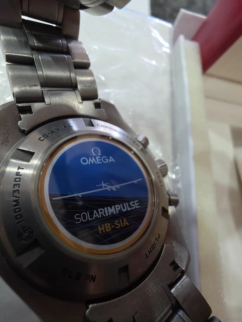 Chronographe automatique Omega Speedmaster HB-SIA GMT d'occasion. Bon état.