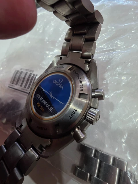 Chronographe automatique Omega Speedmaster HB-SIA GMT d'occasion. Bon état.