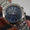 Omega Speedmaster Triple Date 3523.80.00, papiers, boîte générique, 1 an, GTE, 2003